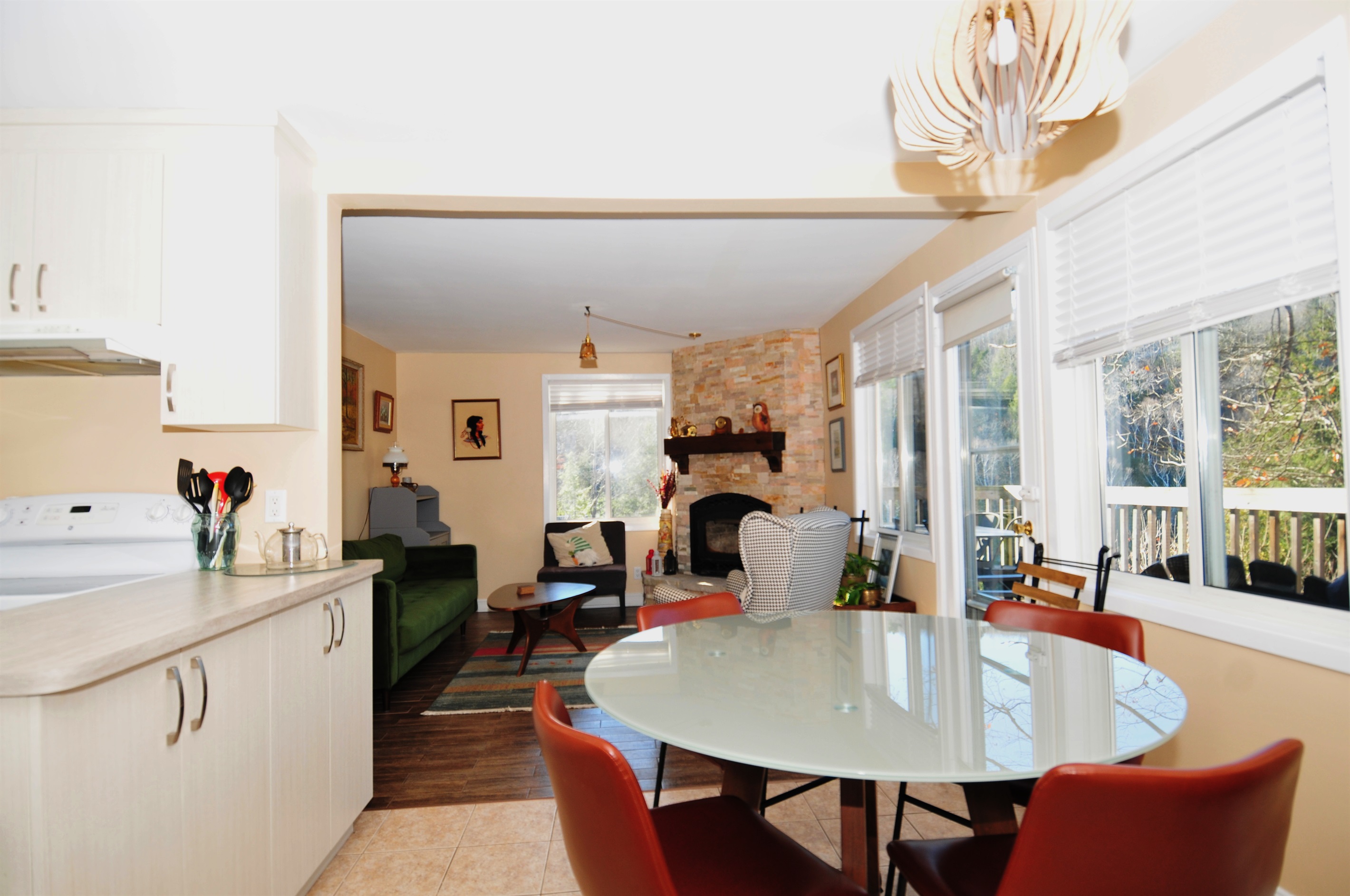 View from dining area with living room and fireplace