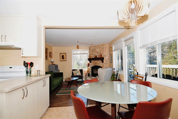 View from dining area with living room and fireplace