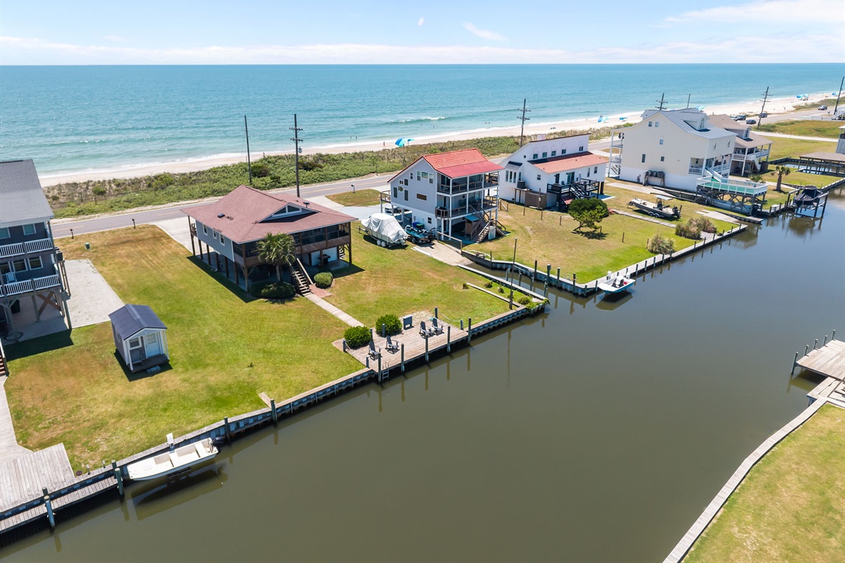 Experience dual waterfront living with canal serenity on one side and ocean breeze on the other