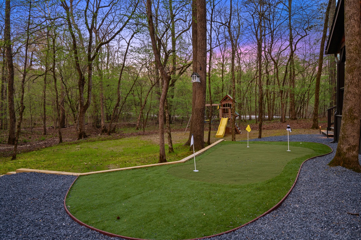 Adding a playful touch, the mini golf setup offers a fun activity that everyone can enjoy right on the property.