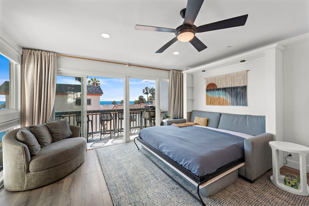 King-sized sofa murphy bed expanded. This bed is every bit as comfortable as a traditional bed with a premium mattress. This King murphy bed enables this one-bedroom condo to accommodate up to four people comfortably.