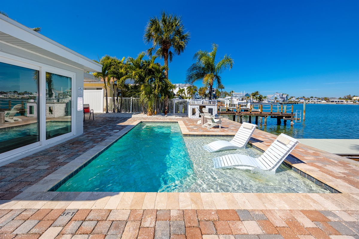 spend your time lounging out by the pool and soaking up the sun