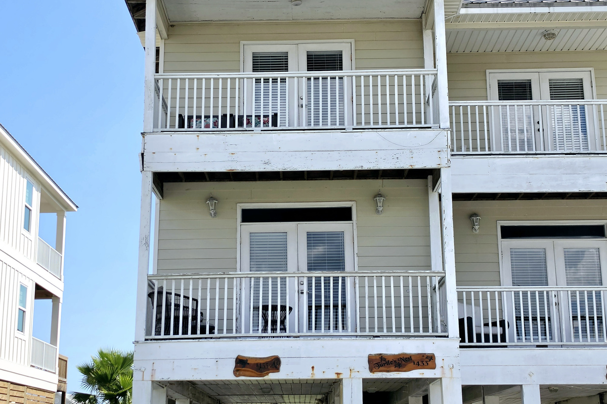 Covered balconies on both upper levels