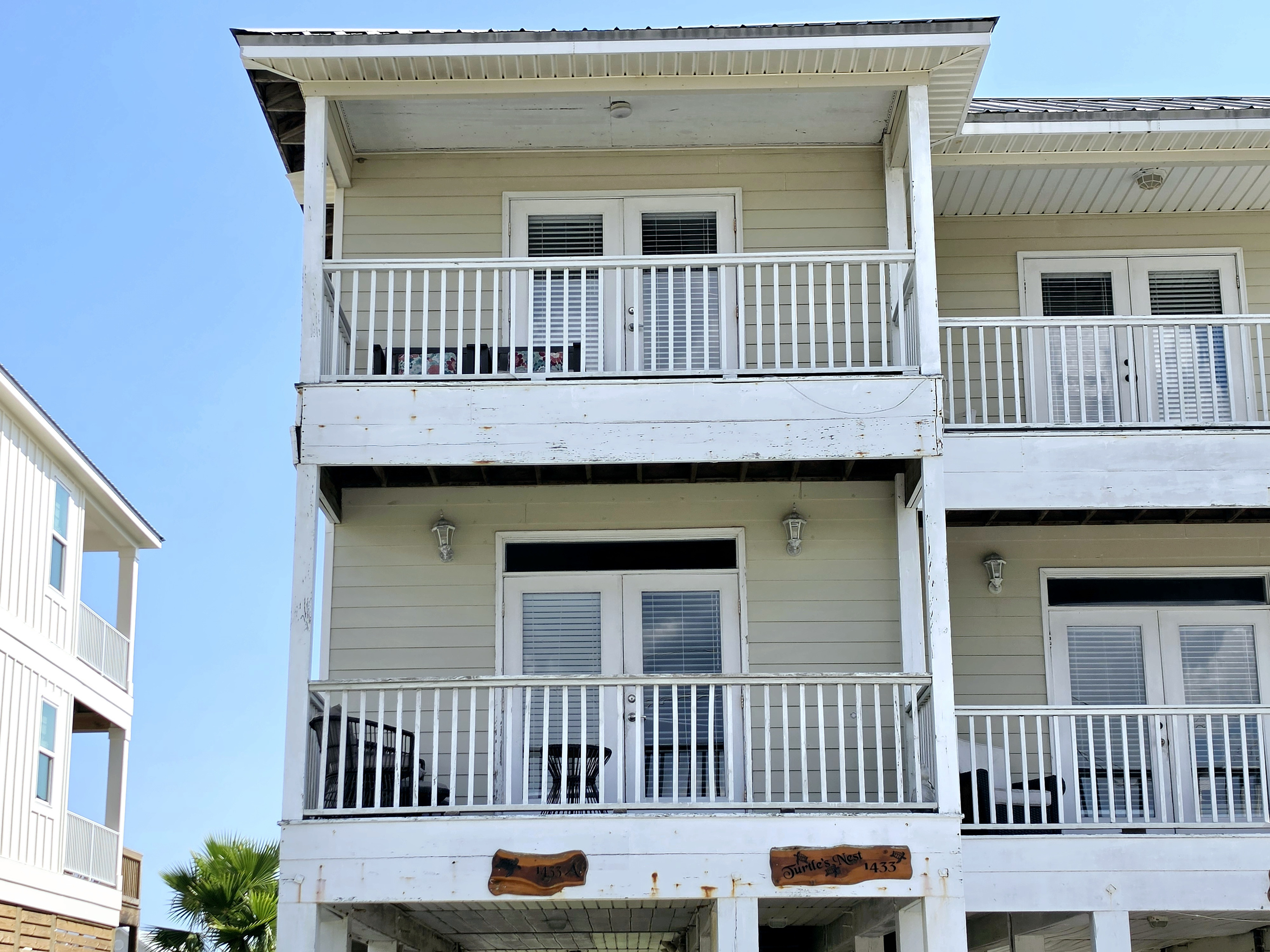 Covered balconies on both upper levels