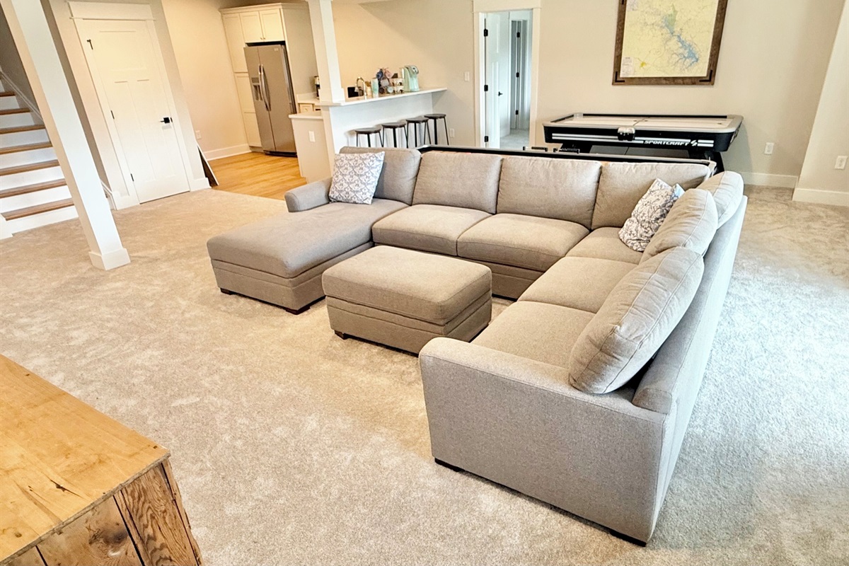 The lower level is unique as it offers a separate living space for families who are vacationing together with a kitchen, two king suites, quad bunk room, game room, arcade, shuffleboard, air hockey, (coffee bar coming soon!). Updating all pics soon!