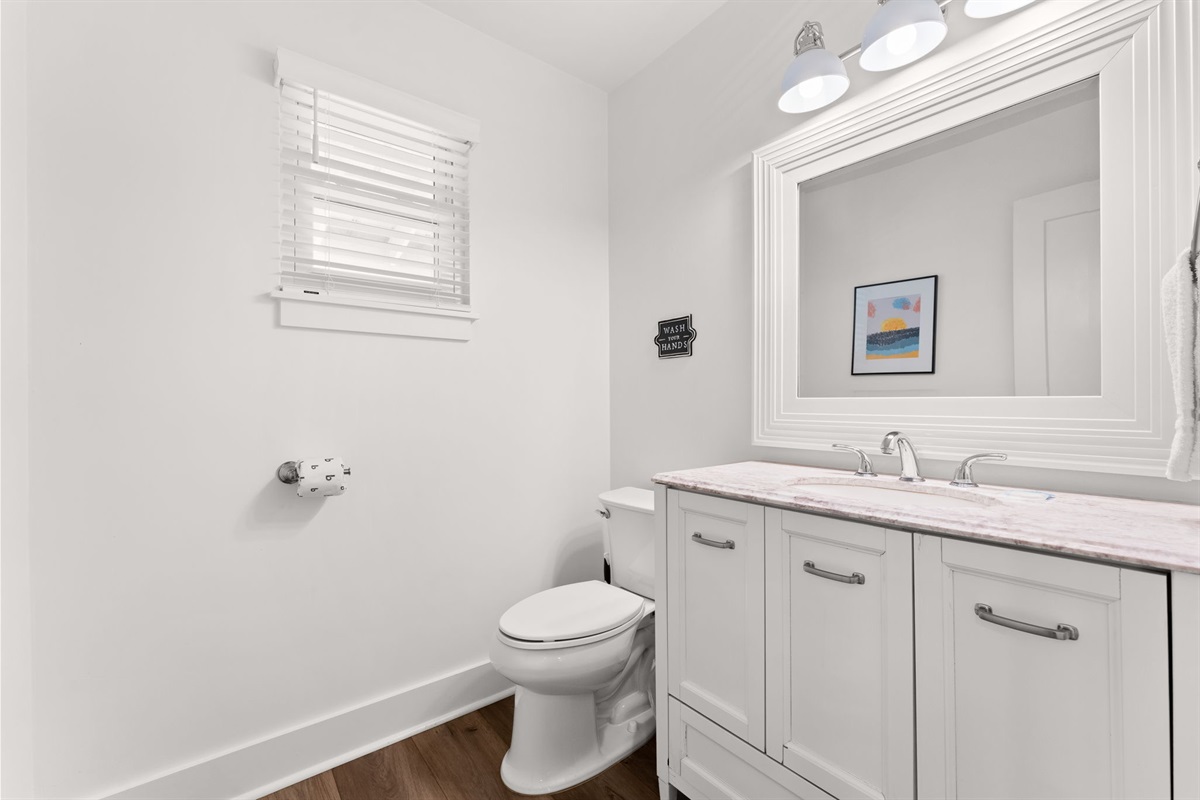 Side B: Polished 2nd-floor powder room located just off the main living area.