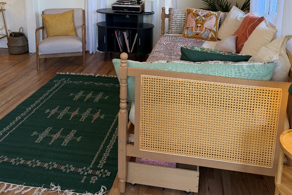 Twin day bed with pillows and linens provided