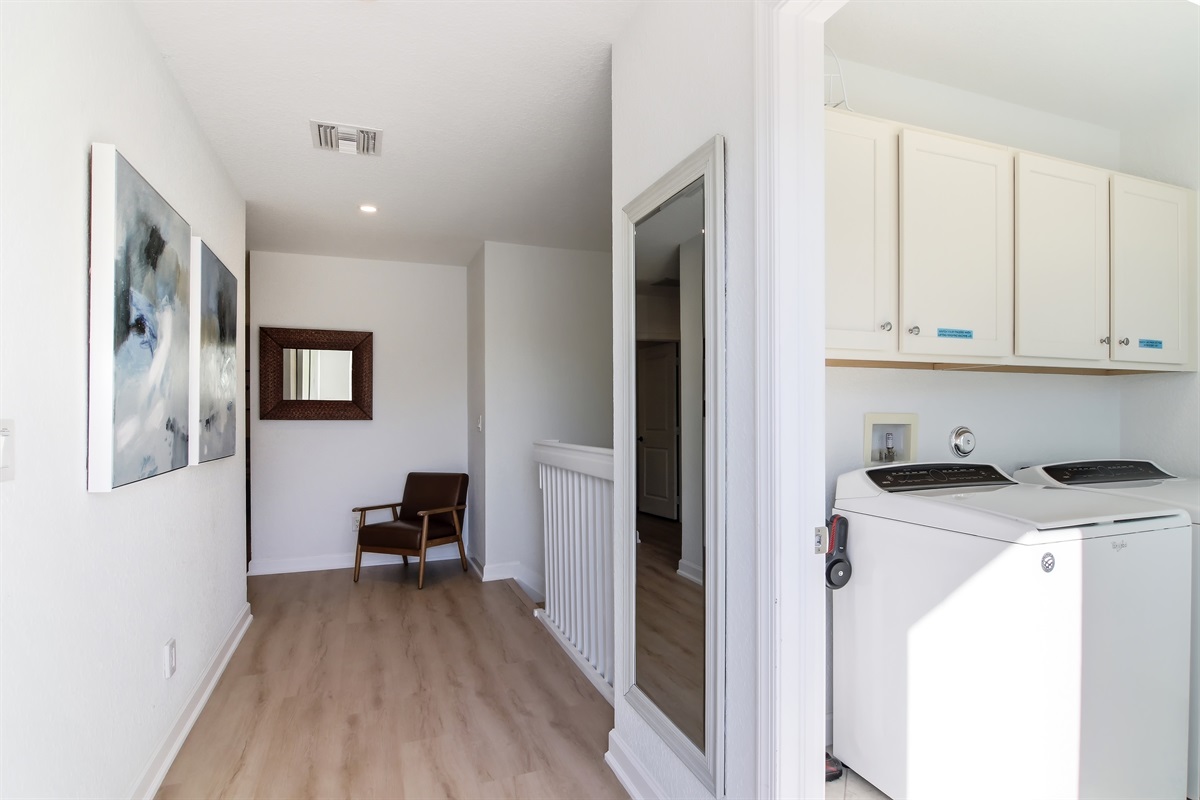 Separate laundry room with full size washer, dryer and a pool view!