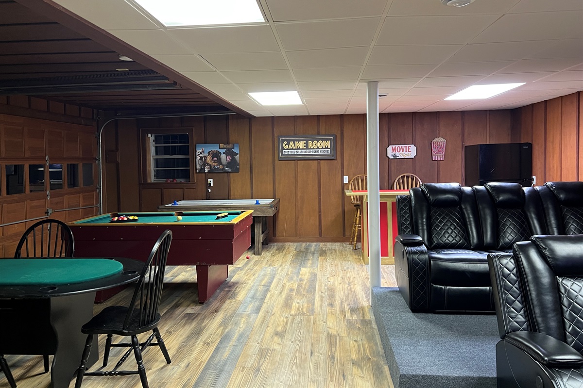 Something for everyone to enjoy in the game and theater room. Includes large fridge with freezer.