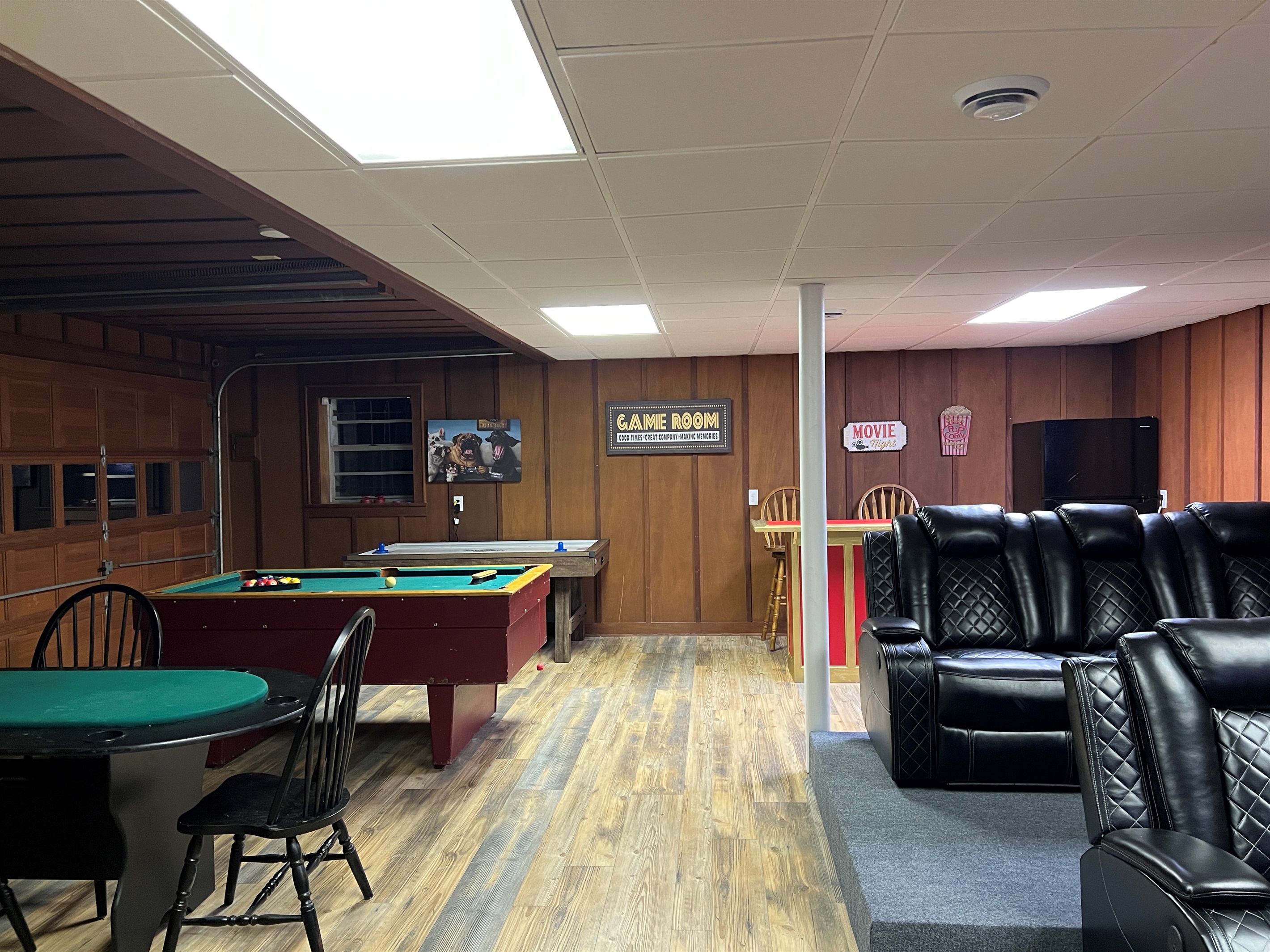 Something for everyone to enjoy in the game and theater room. Includes large fridge with freezer.