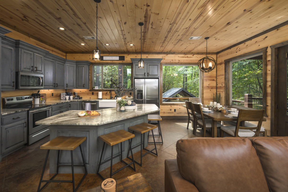 Step into culinary bliss in this stylish kitchen. Those gray cabinets and sleek stools make it the perfect spot for family gatherings.