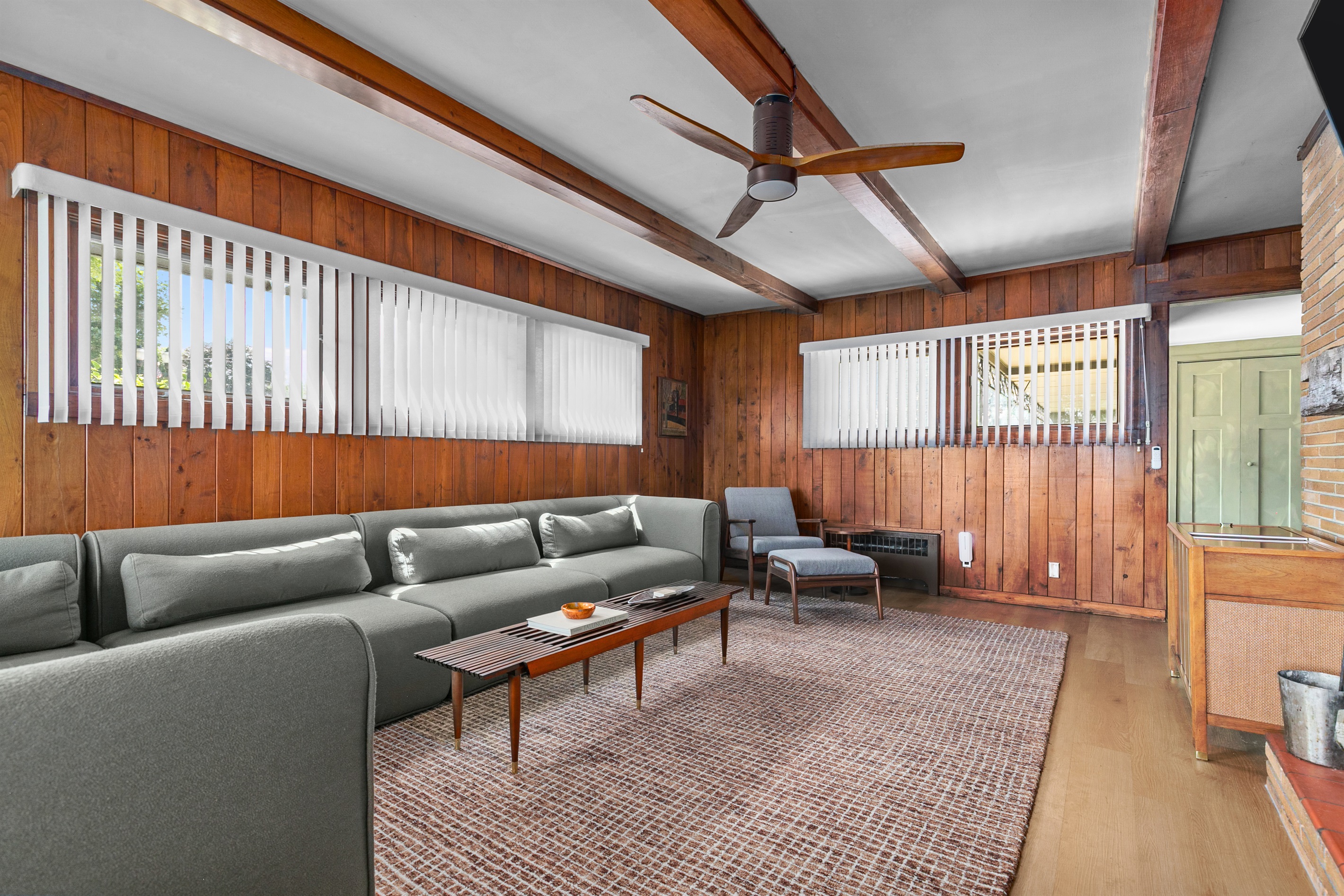 The living room is a modern lounge space, blending sleek design with comfortable furnishings to create the perfect spot to relax and unwind.