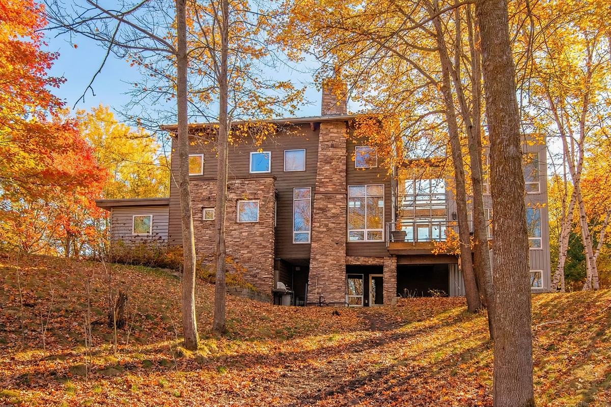 Expansive backyard leading down to the water and private dock