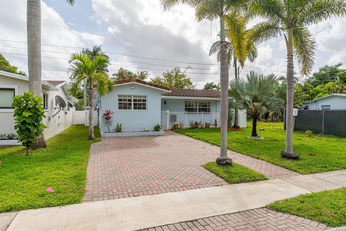 Beautiful 4 bedroom, 3 bathroom pool home in a family-friendly, safe neighborhood. Features a wide paver driveway, tropical palms, and welcoming curb appeal.