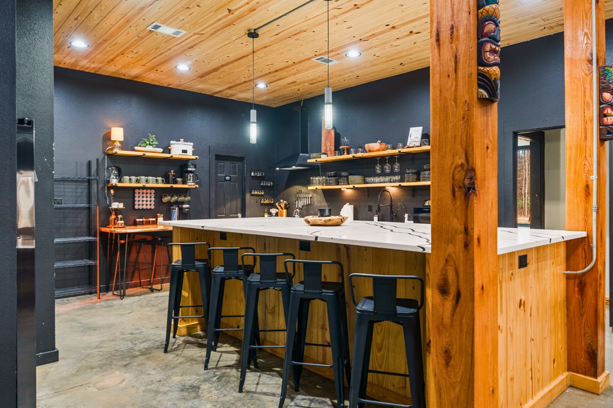 Pull up a stool and settle in at the bar, where conversations flow easily and everyone feels connected to the heart of the home.