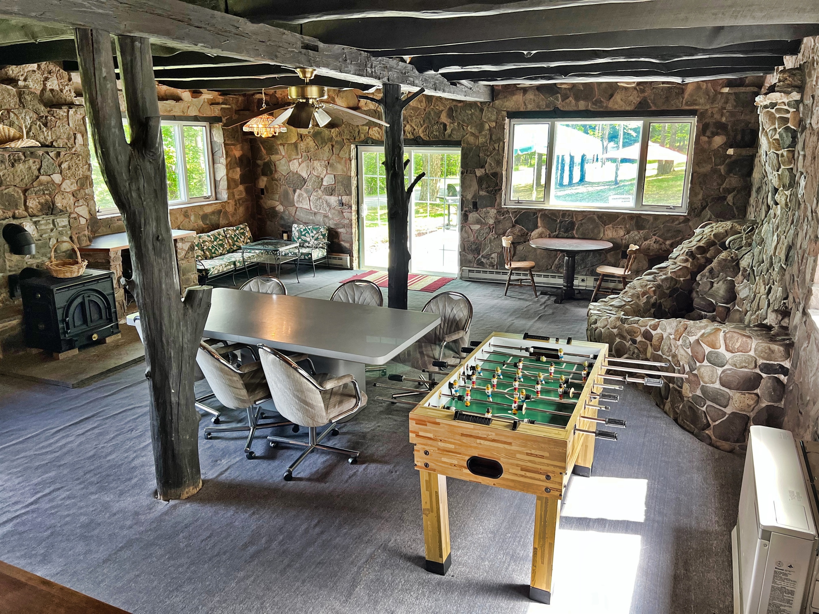 Great room with foosball and formal dining area. The stone feature was once and indoor fountain! (it is no longer)