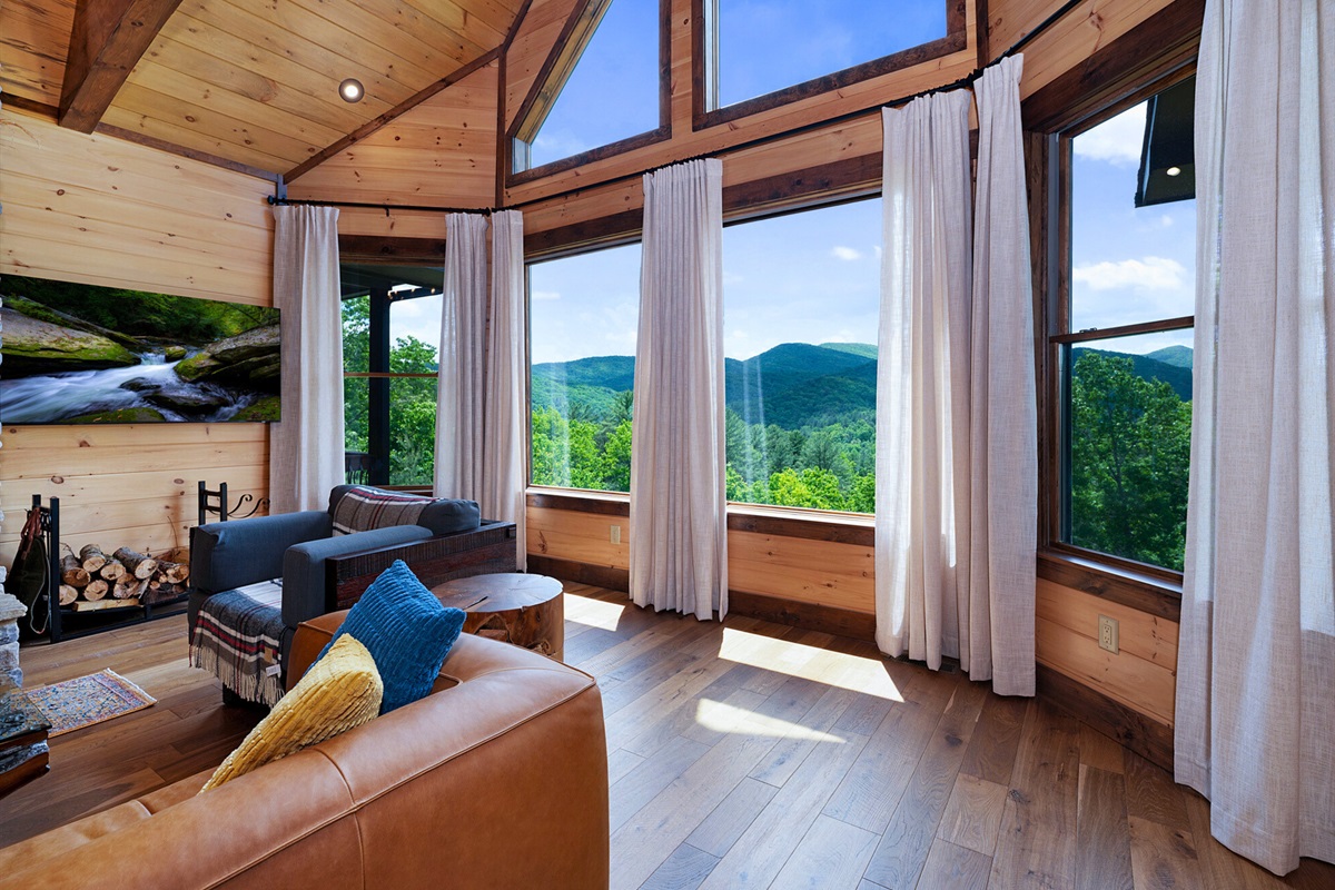 Relax in this sunny lounge area, where comfort meets nature with beautiful mountain views all around.