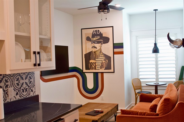 Living area with comfortable seating and natural light, perfect for relaxing after exploring Frisco’s Rail District.