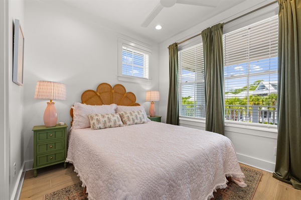 This welcoming queen guest room features comfortable furnishings, coastal-inspired décor, and a relaxing atmosphere.