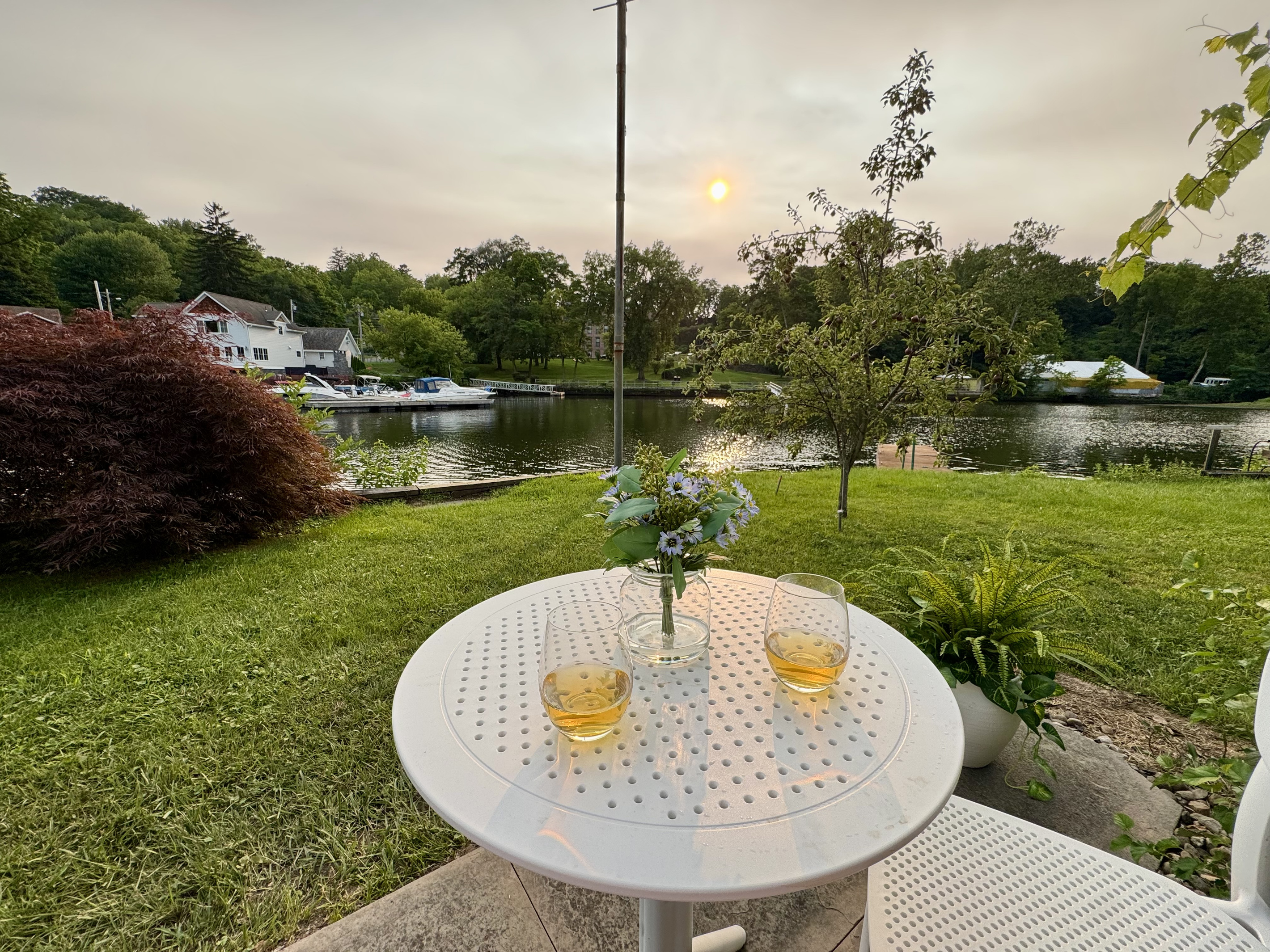 End the day with a glass of wine and one of the best seats on the river.