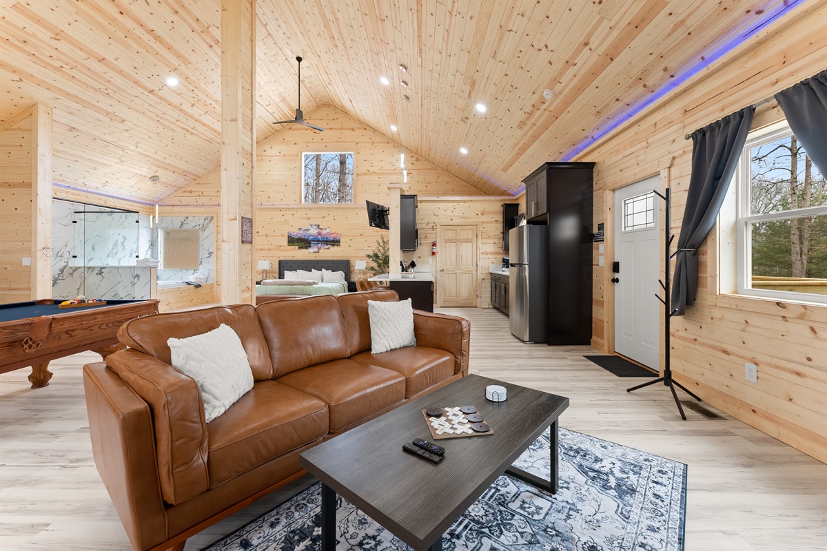 Leather furnishings with 65 in. big screen streaming tv.