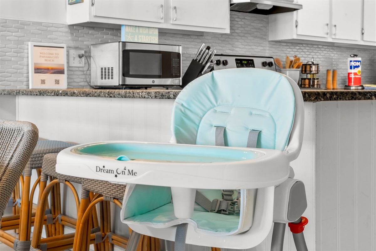 High chair is stowed away in the master bedroom closet.