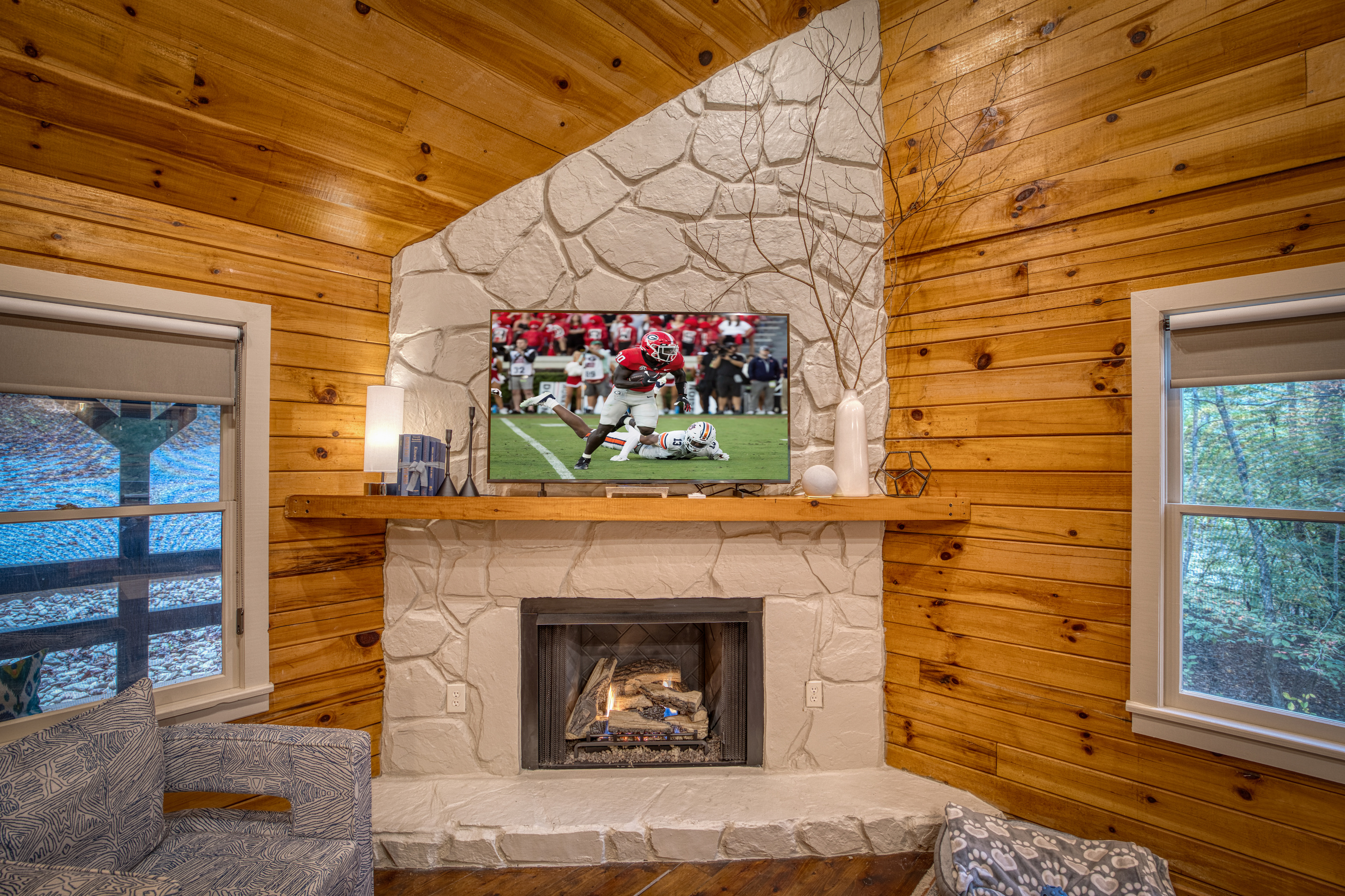 Fireplace with a mounted TV.