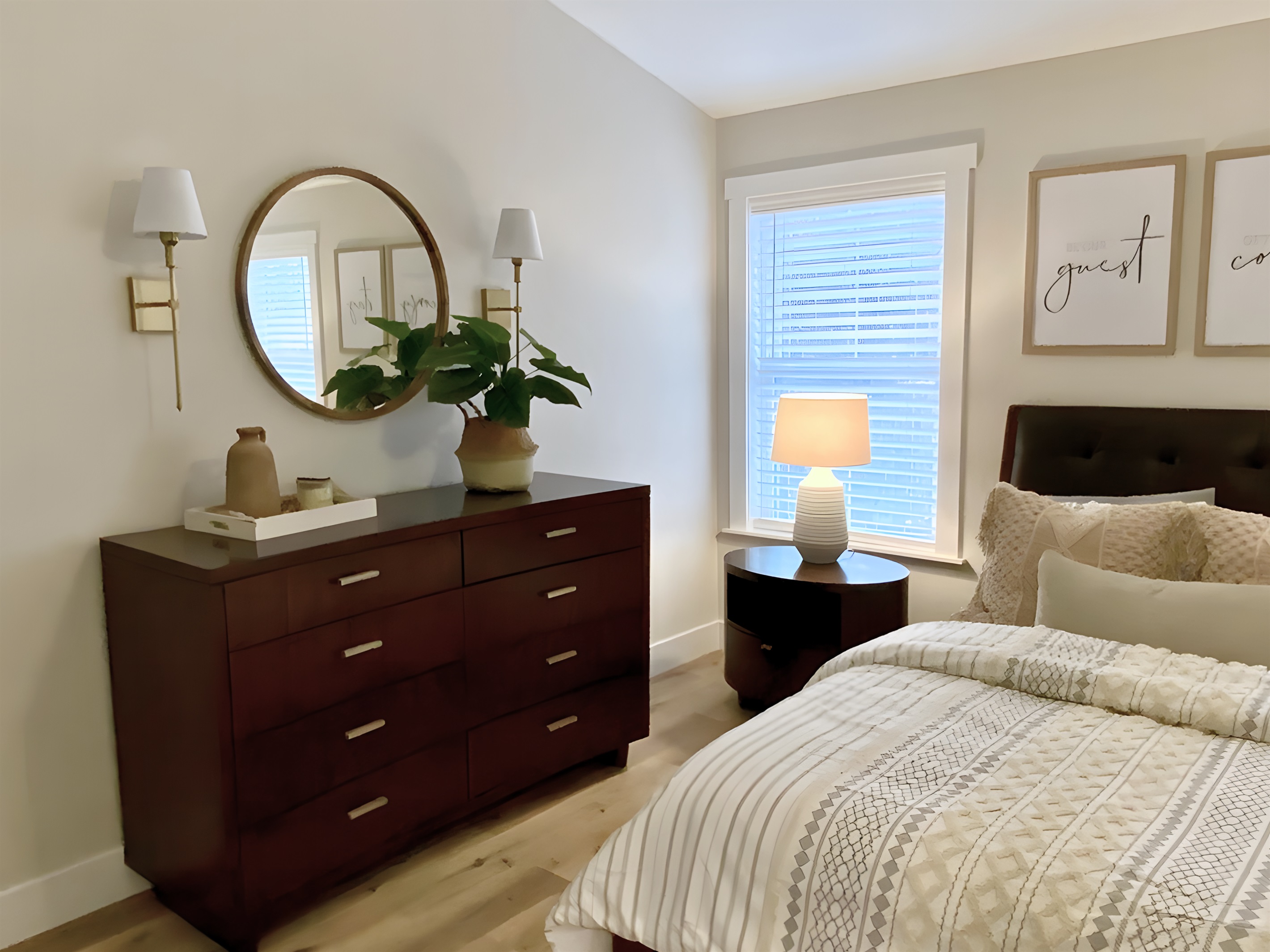 Relax in this cozy queen bedroom, featuring stylish decor and ample natural light. With luxurious linens, a spacious dresser, and thoughtful touches, it’s the perfect retreat. 