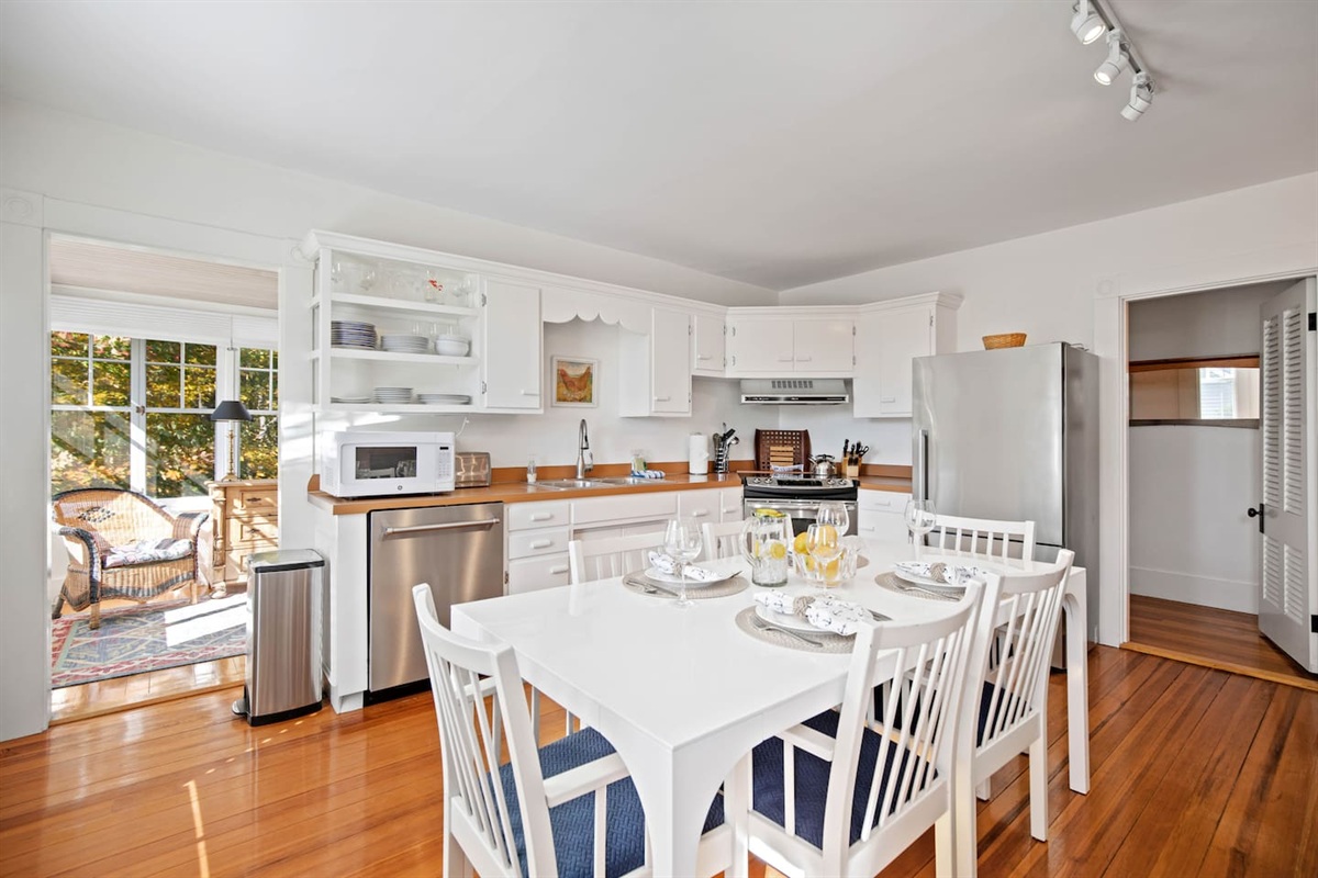Walk through the living room to find the kitchen as well as the sunroom/bedroom.
