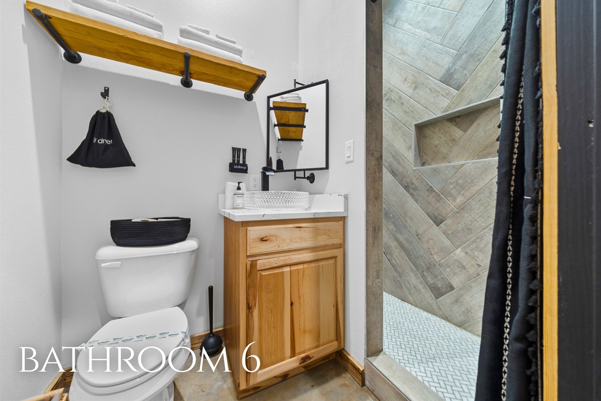 Bathroom 6 combines practical design with warm finishes, making everyday routines feel a little more elevated.