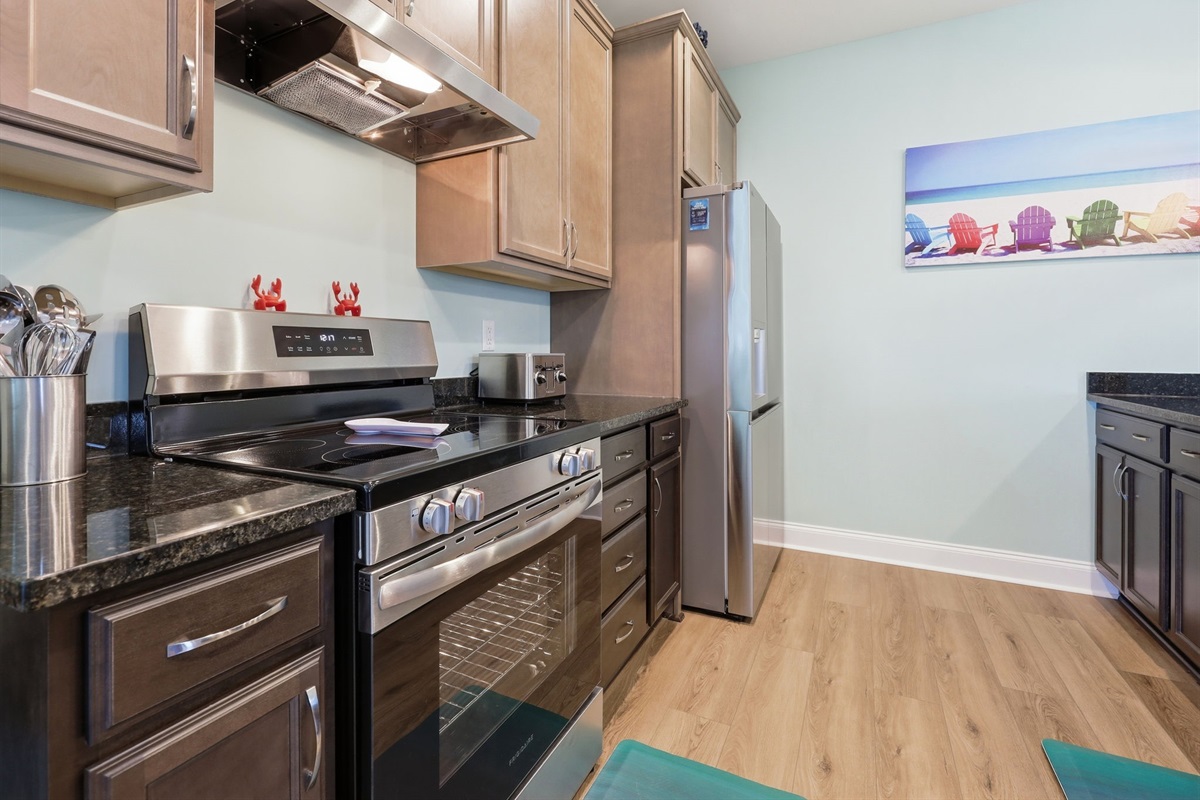 Fully equipped kitchen with modern appliances and ample counter space