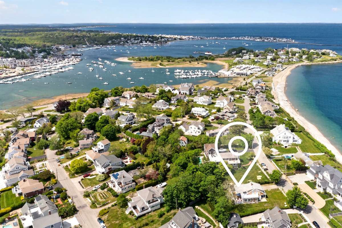 An aerial view of the house and its surrounding coastal landscape.
