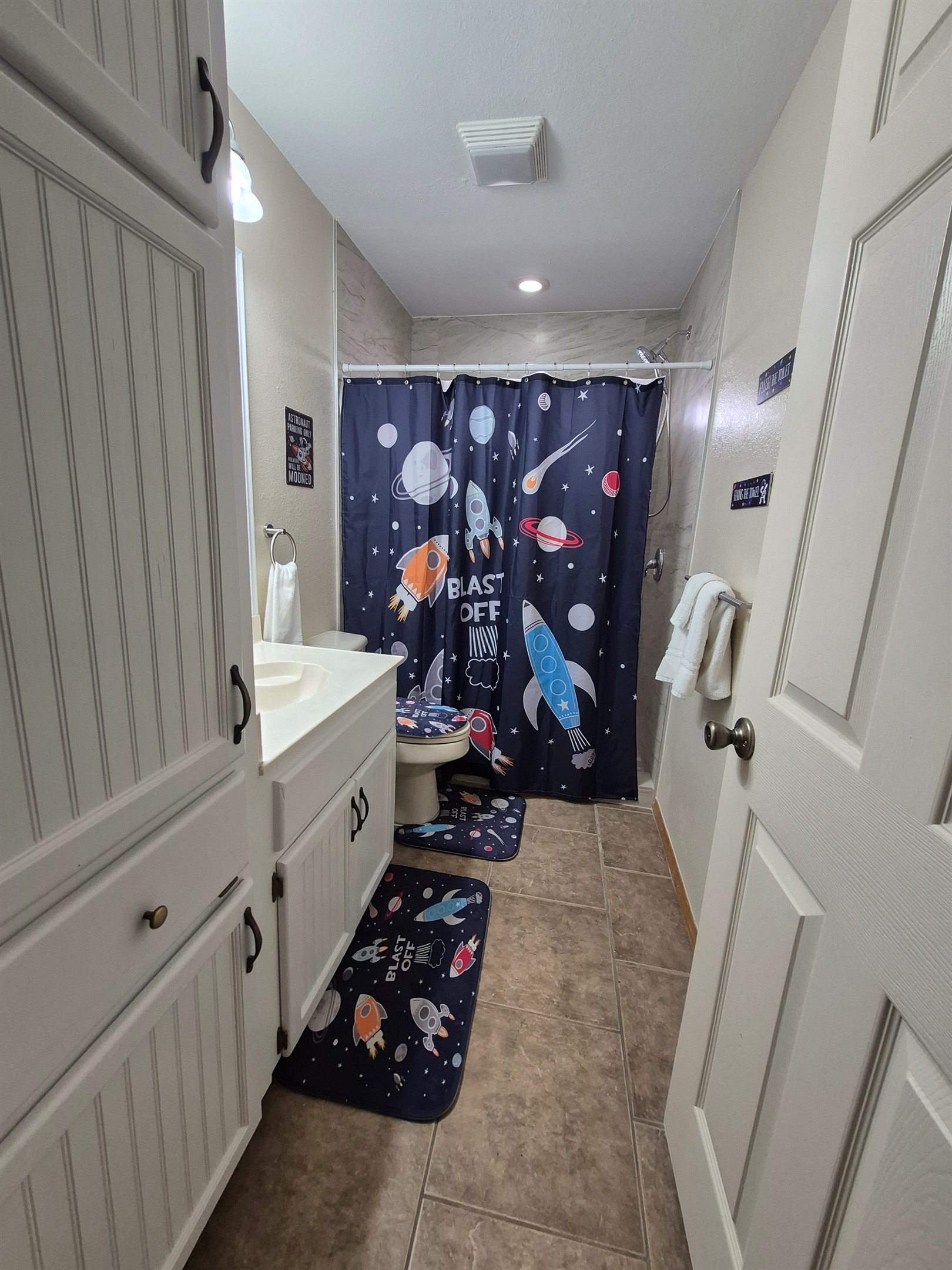 Ground floor bath servicing the bunk room and pool areas with walk-in shower with bath toiletries provided. 