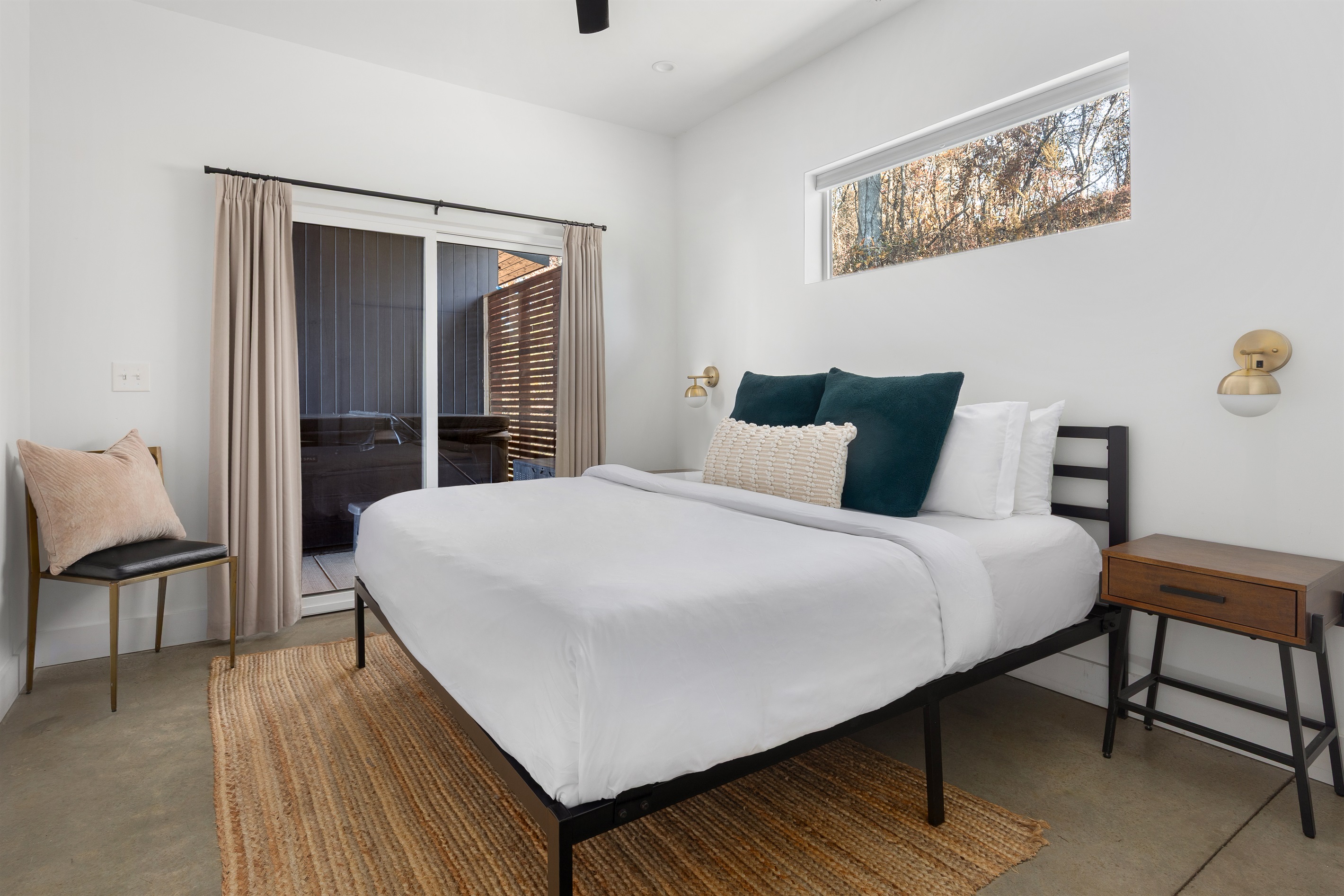 {Bedroom - Glass House} A calming Queen suite with private hot tub access just outside your sliding doors—perfect for a quiet reset.