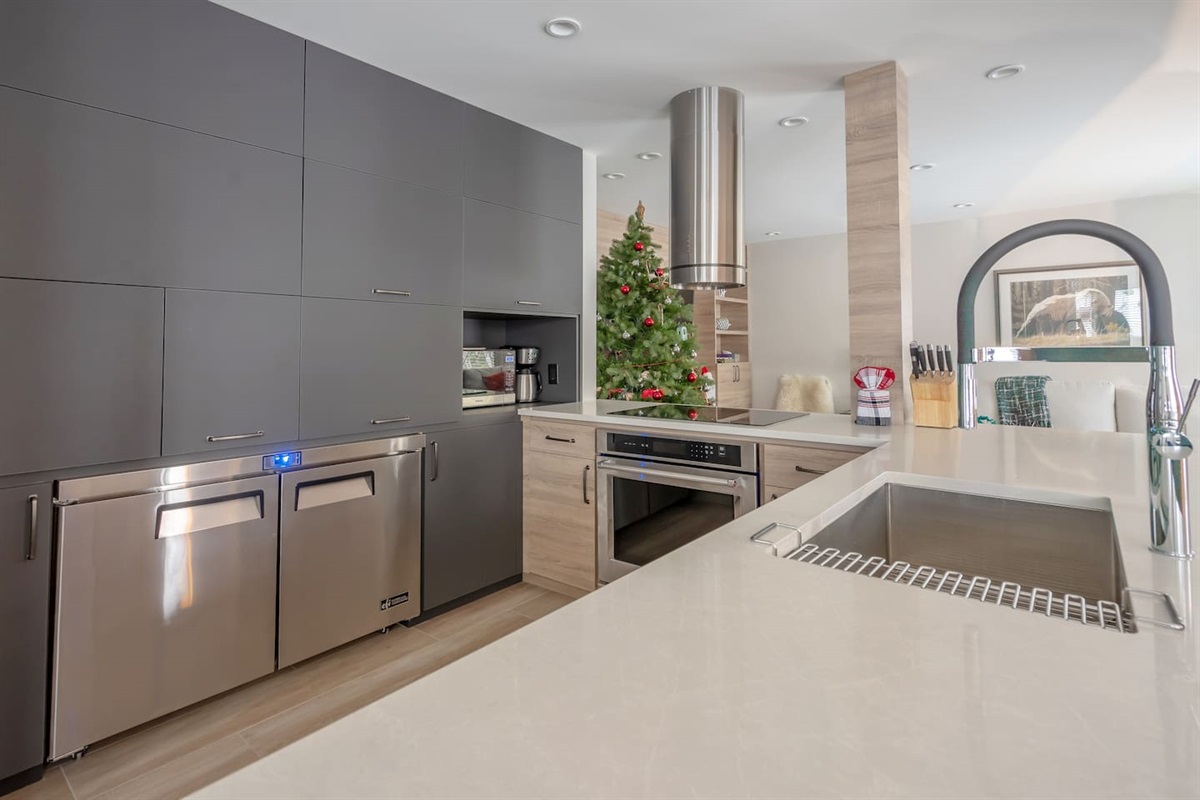 Modern, spacious open concept Kitchen & Living makes for wonderful family & group gatherings. Wolf Cooktop, Built-In Convection Oven, commercial under counter fridge & integrated under counter freezer, Bosch Dishwasher, dining table seats 10ppl  