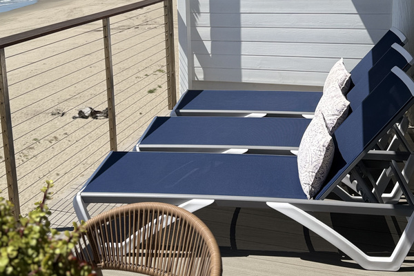 Beachfront living at it's finest! Enjoy newly remodeled sun-drenched deck with panoramic ocean views!