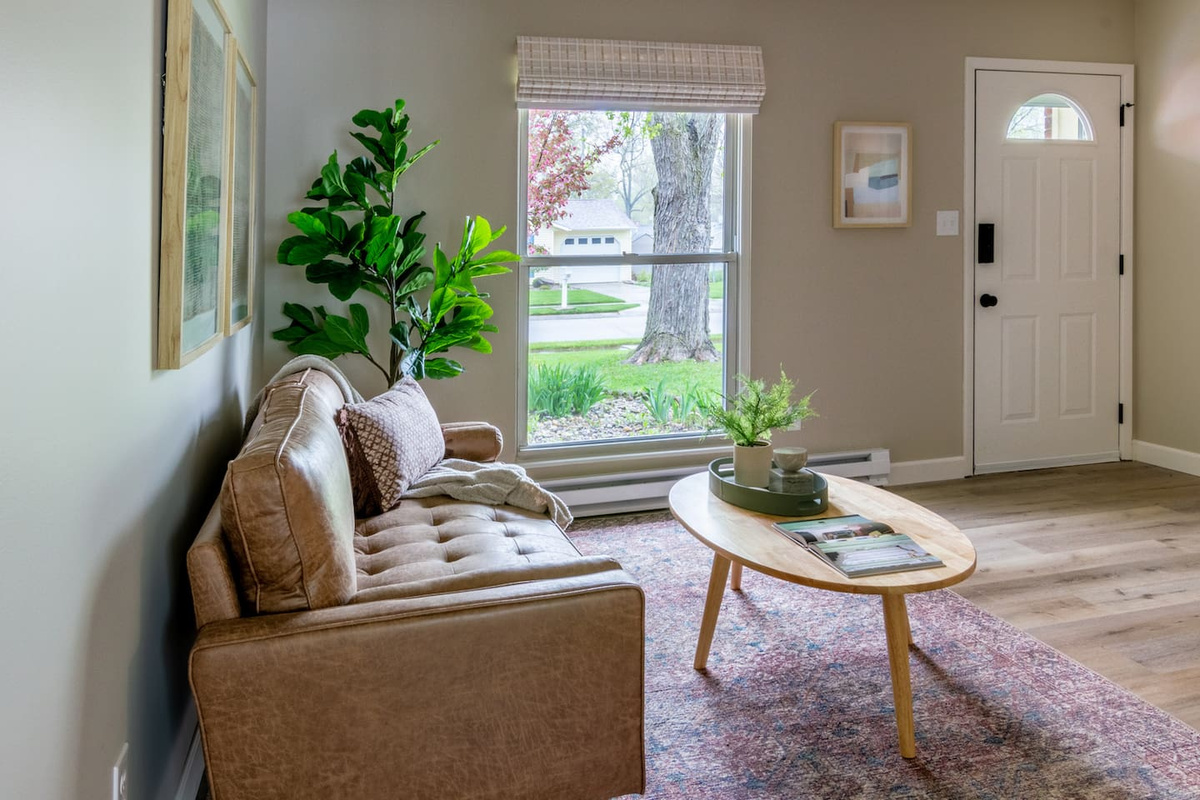 A sunny sitting spot by the front door, perfect for morning coffee or evening wind-down.