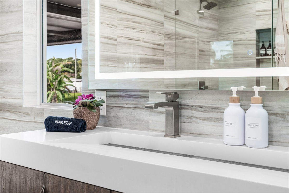 Clean lines and refined finishes elevate this modern vanity, where natural light and thoughtful details create a fresh, spa-like atmosphere.