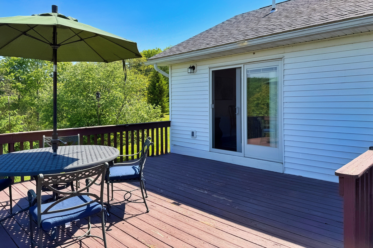 Sliding glass doors from dining room lead out to the deck.