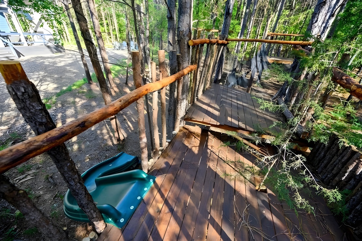Elevated among the trees, the treehouse-style platform adds a sense of adventure to the property.