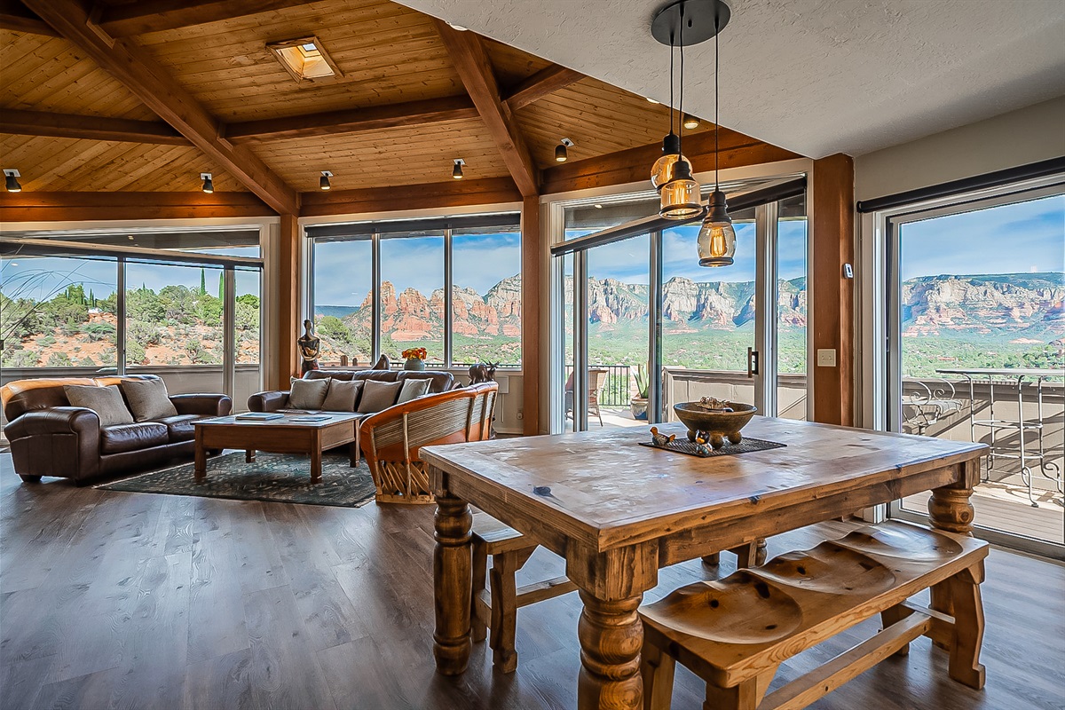 Spacious, high-end interior with a stylish six-person dining table.