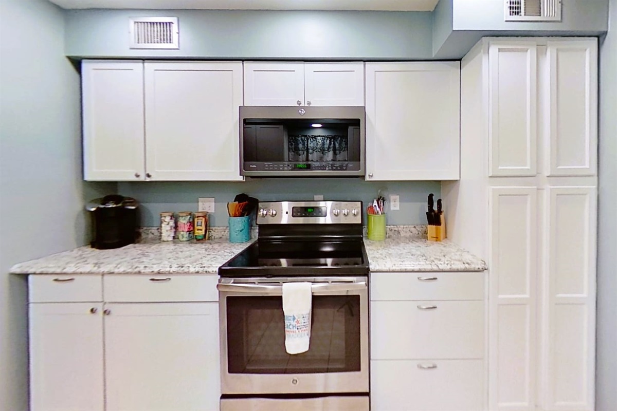 Full Kitchen, complete with oven, electric stovetop, microwave, Keurig with cream and sugar packets, as well as hot tea. Pantry is also stocked with lots of spices for cooking, as well as basic condiments. We want you to feel like your home!!