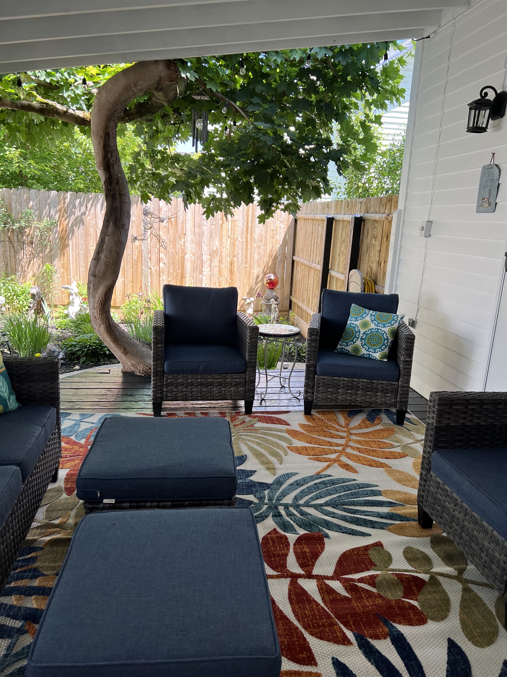 Covered rear porch with incredible maple tree