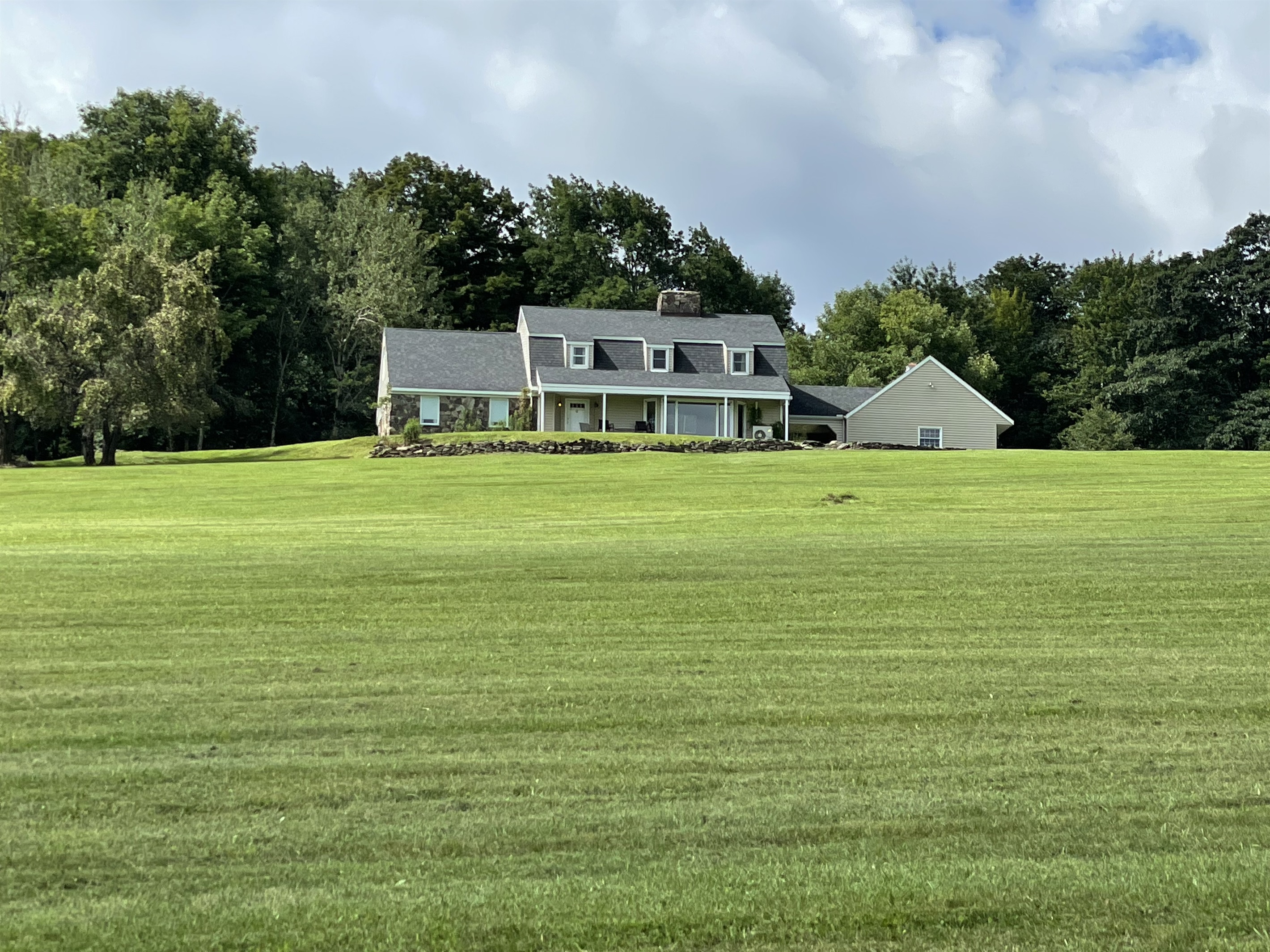 Hilltop Hideaway large front lawn with lots of room to play ball!