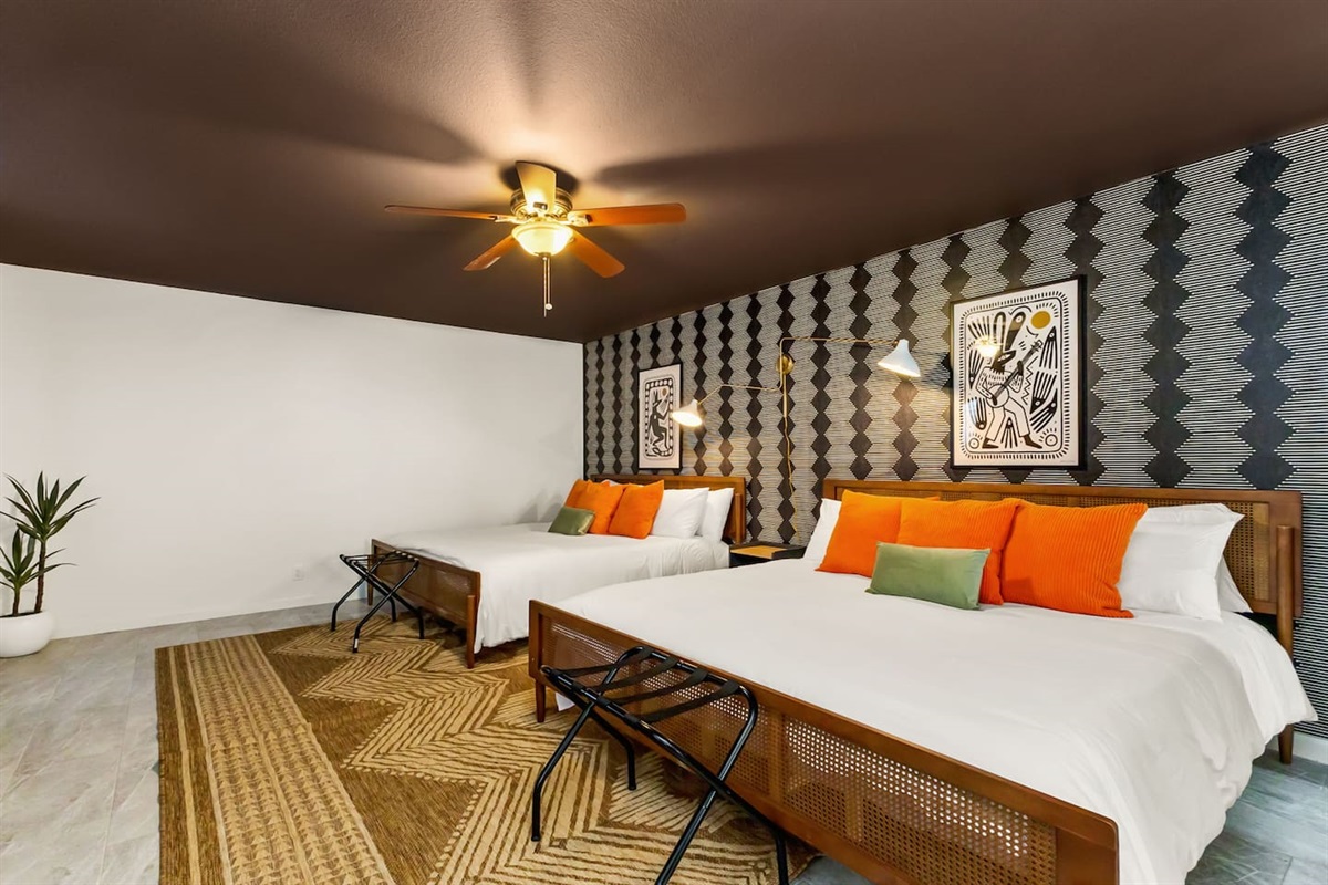 Perfect for families, friend groups, or business travelers this spacious room  on the main floor offers two plush king beds, modern décor, and plenty of space to unwind after a day exploring San Antonio. Comfort, character & convenience all in one!