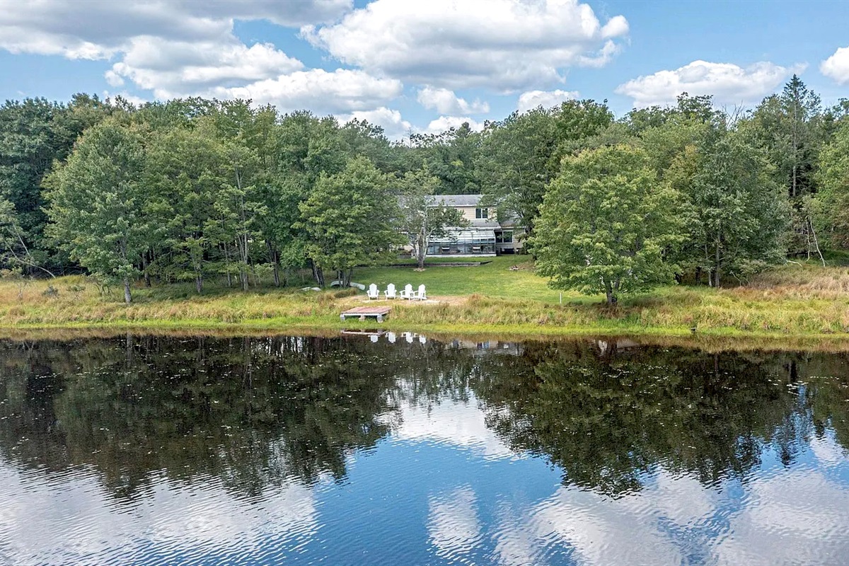 The house that mirrors the lake — architectural poetry.