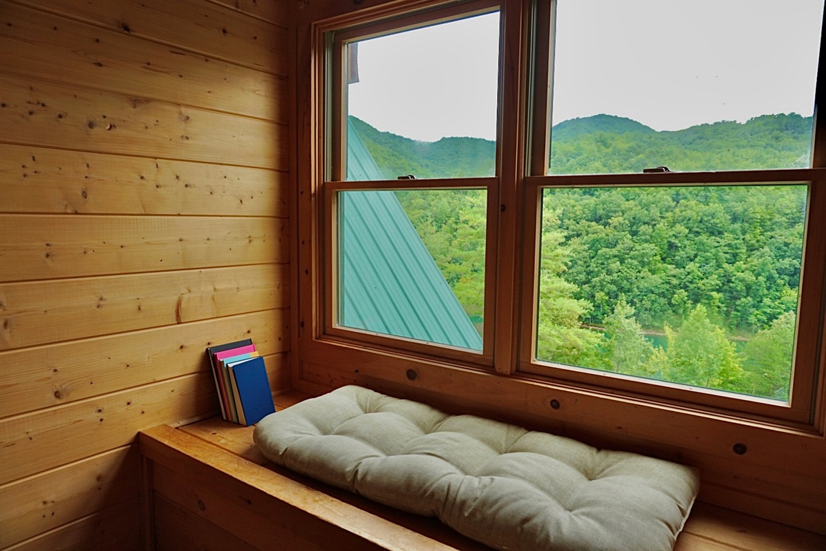 Window Nook: Unwind here with stunning mountain views and a perfect reading spot!