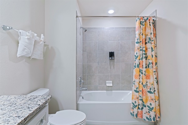 Family-friendly bathroom with a shower/tub combo—ideal for kids and designed with comfort and convenience in mind.