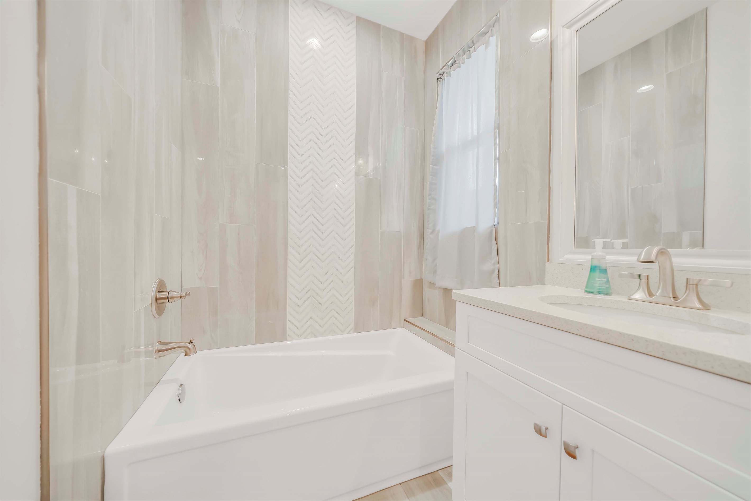 Enjoy a hot soak in the bath tub after a long day of exploring the town. This master en suite has a separate soaking tub and shower!
