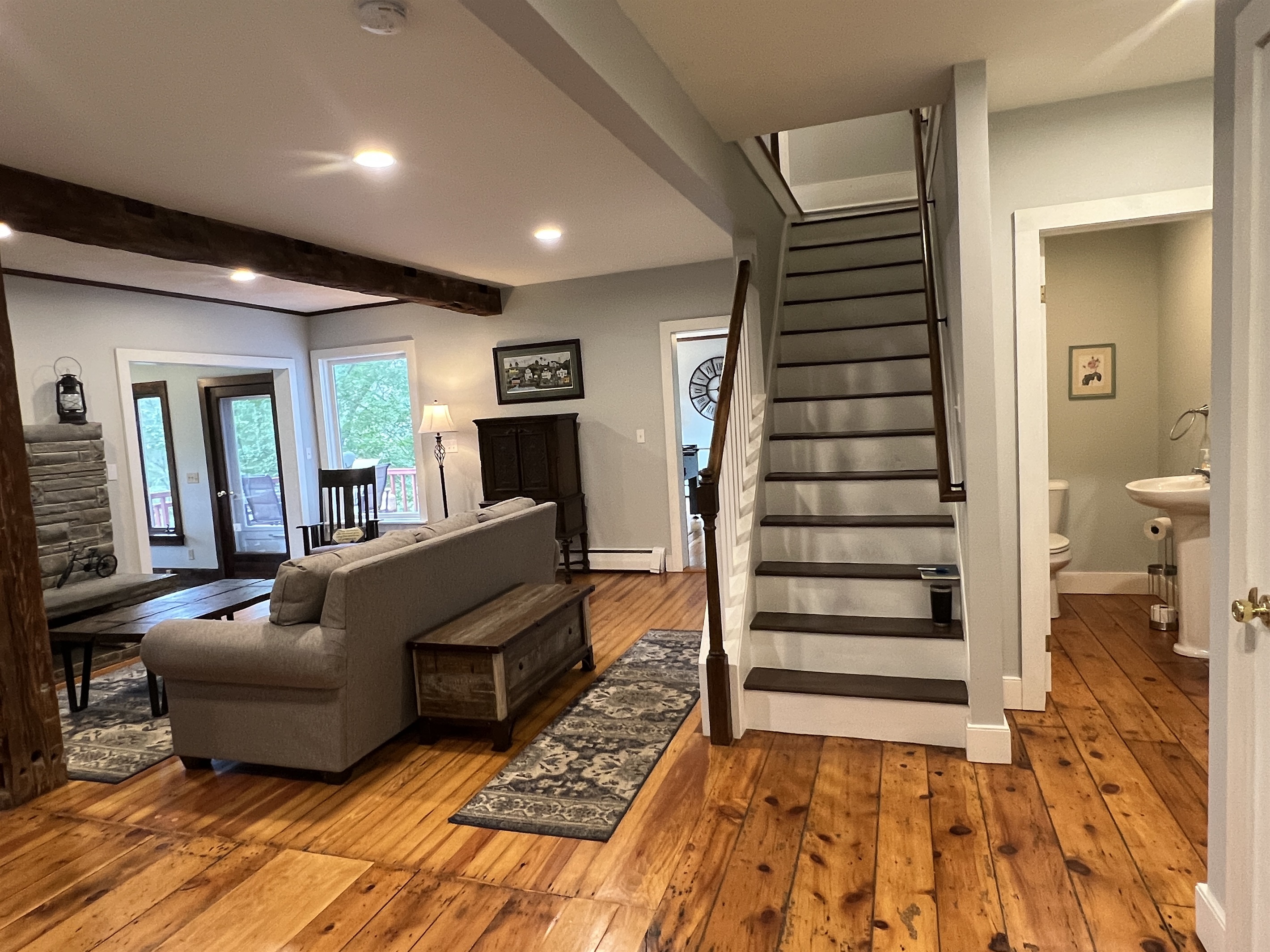 Cloverleaf Farm stairs leading to the 2nd floor. The 1st floor half bathroom to the right.